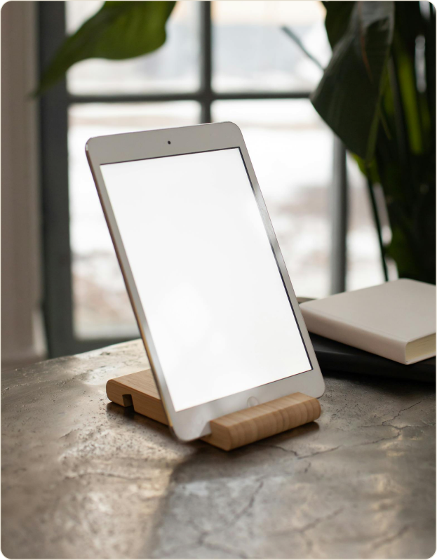 A pre-configured tablet on a table by a window