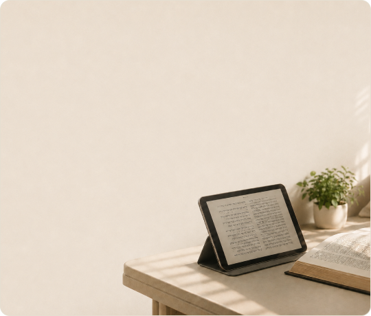 A pre-configured tablet showing the daily shiur on a table by a window